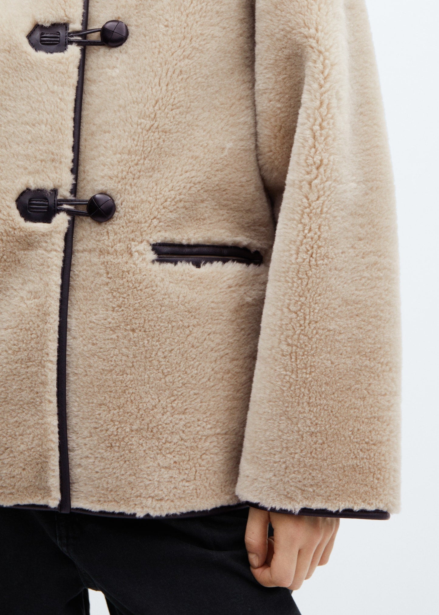 Faux fur coat with applications